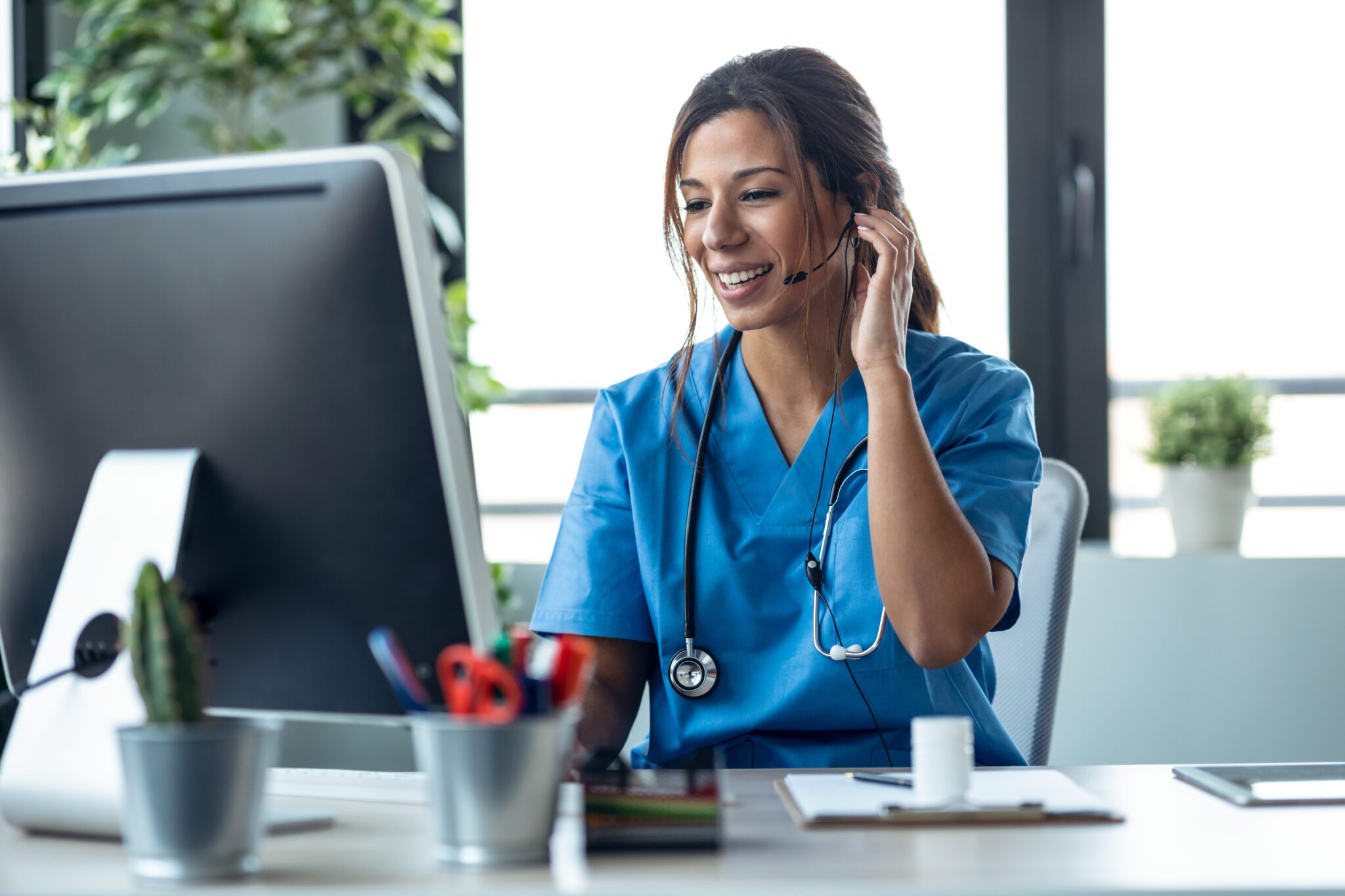 Female doctor talking with earphone while explaining medical tre